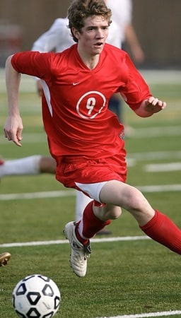 Boy playing soccer game